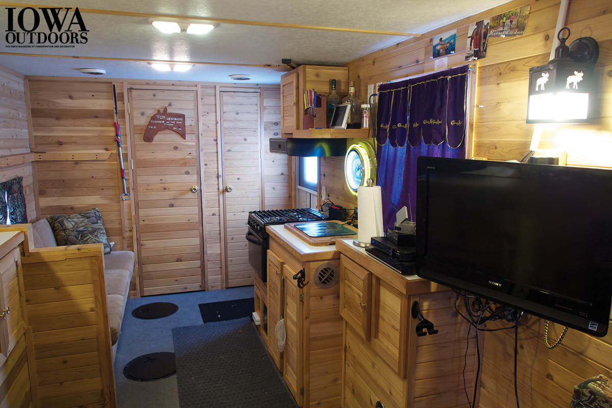 Think ice fishing is only sitting on a bucket in the cold waiting for the fish to bite? Iowa Outdoors toured some of Iowa's swankiest ice shacks, and we found kitchens, satellite TVs, stereos, underwater cameras and more! | Iowa DNR