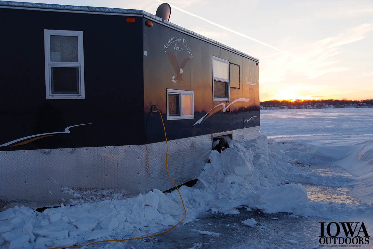Think ice fishing is only sitting on a bucket in the cold waiting for the fish to bite? Iowa Outdoors toured some of Iowa's swankiest ice shacks, and we found kitchens, satellite TVs, stereos, underwater cameras and more! | Iowa DNR