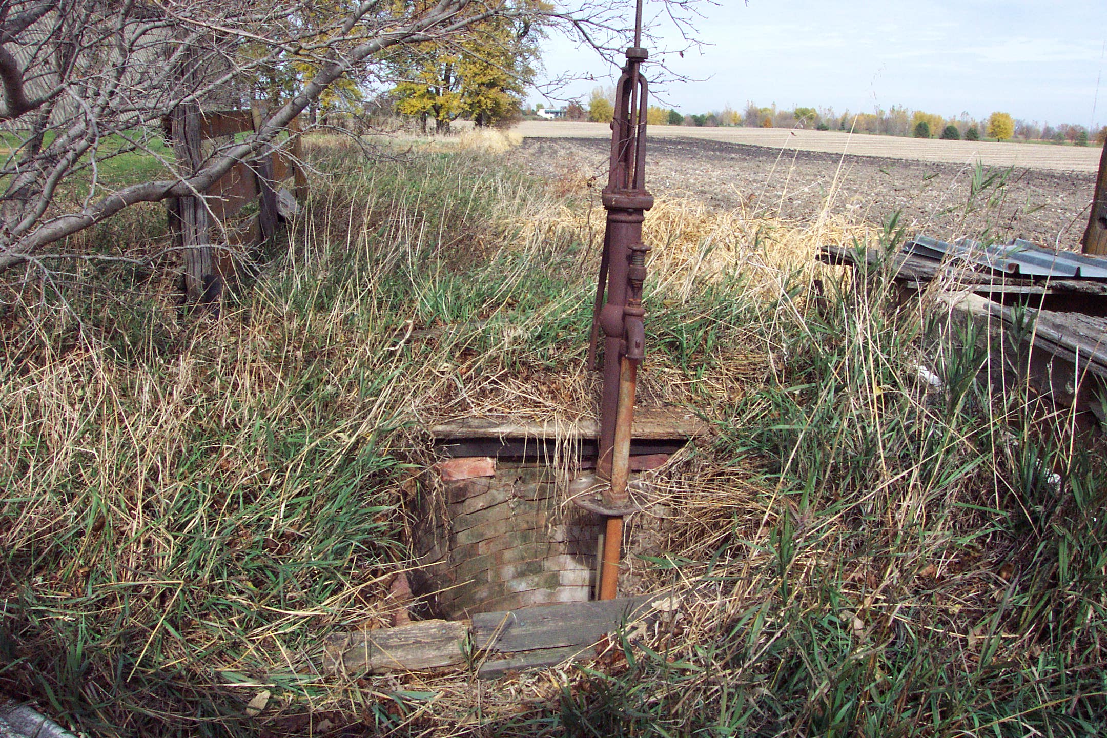 An image of an old abandoned water supply well in desperate need of proper plugging.