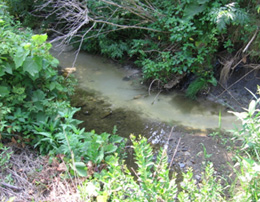 Well construction discharge at the point of stream entry.