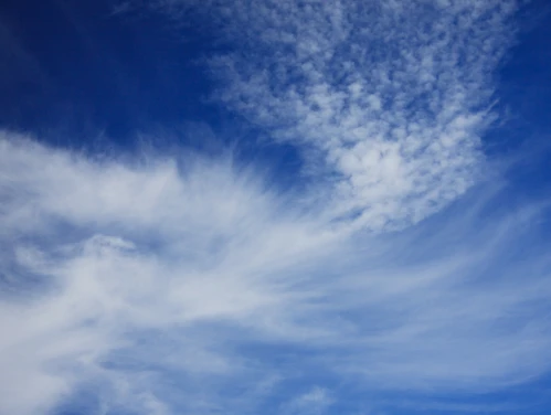 Blue skies and wispy clouds.