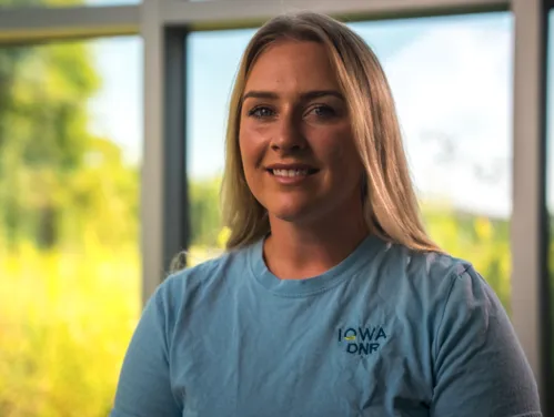 This image shows Sophia Campbell, the DNR’s Watershed and Source Water Protection Coordinator at the Decorah Fish Hatchery