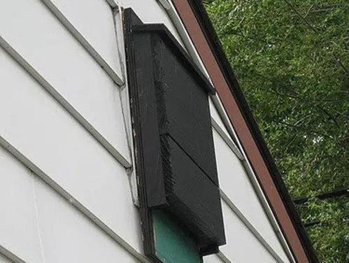Bat house on the side of a home.