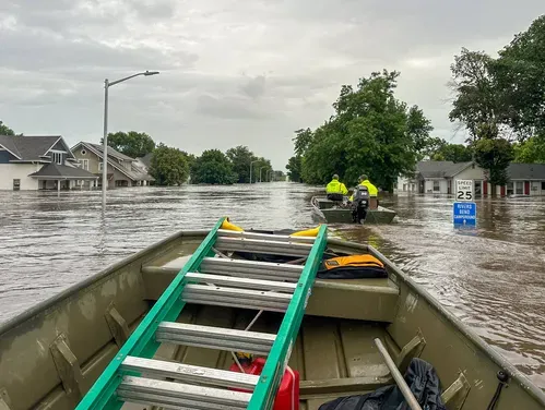 This image shows flooding in a residential area in Rock Valley, Iowa from a boaters perspective 