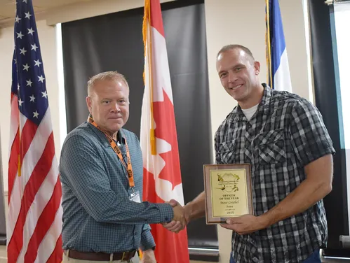 Col. Craig Cutts (left) presents Sgt. Steve Griebel officer of the year award during annual meeting in Okoboji