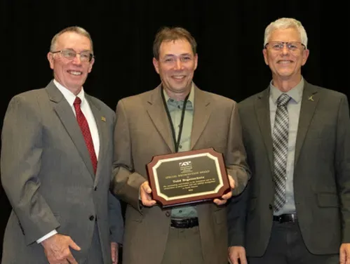 Todd Bogenschutz  receiving a special recognition award from The Association of Fish & Wildlife Agencies