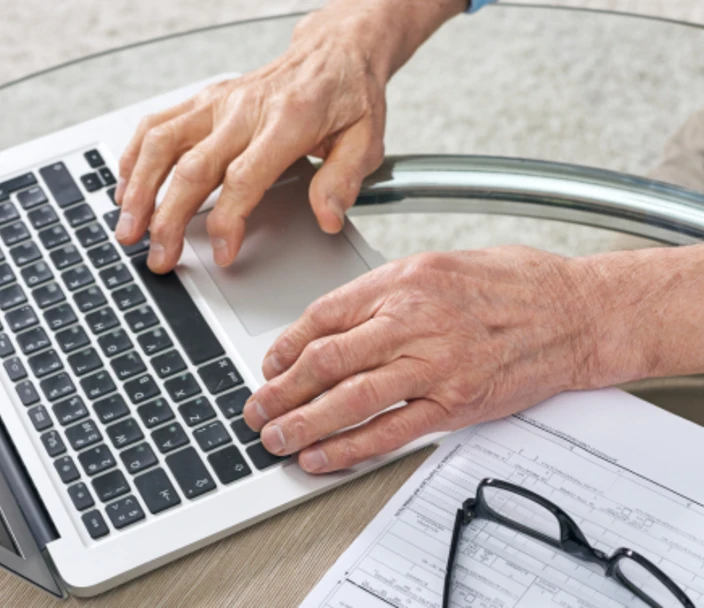 Laptop being used to fill out a form.