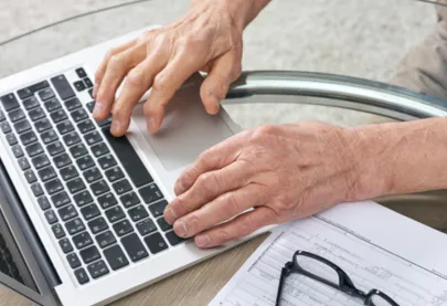 Laptop being used to fill out a form.