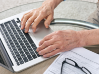 Laptop being used to fill out a form.