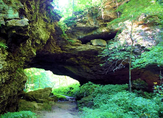 Maquoketa Caves State Park walking train under a large rock formation
