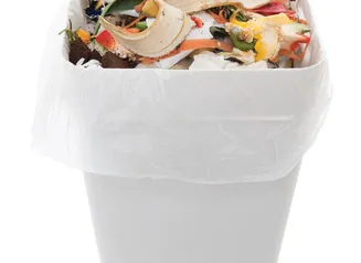 Graphic of a trashcan full of food waste.