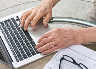 Laptop being used to fill out a form.