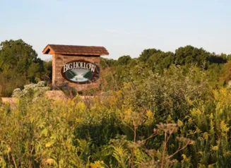 This image shows a sign of Big Hollow Recreation Area in Des Moines County.