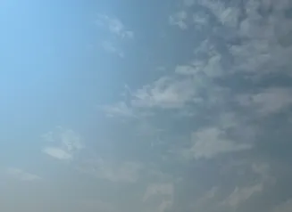 This image shows hazy skies over Iowa due to wildfires in northwest Canada