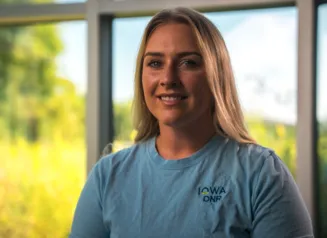 This image shows Sophia Campbell, the DNR’s Watershed and Source Water Protection Coordinator at the Decorah Fish Hatchery