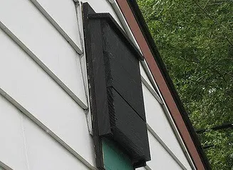 Bat house on the side of a home.