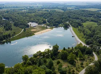 This image shows a drone shot above Kent Park Lake in 2025