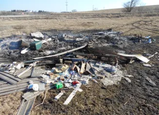 This image show open burning of household waste in a rural area