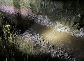 This image shows white colored water in a creek in rural Lee County, Iowa.