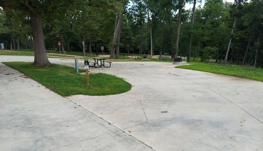 Pike's Peak campground with cement slab lending to accessible electric and full hook-up sites.
