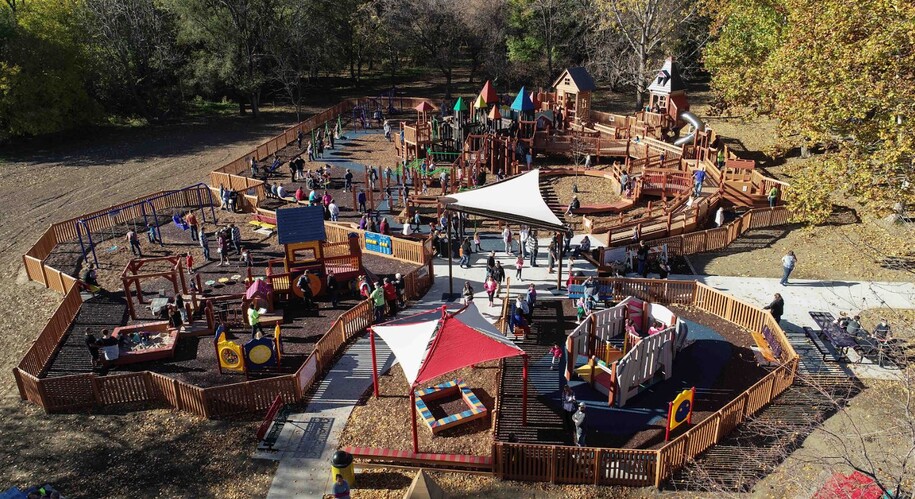 Lake Manawa State Park's accessible playground with many different areas, including swings and slides and fun for all ages and abilities.