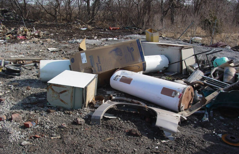 This image shows large household materials and parts dumped illegally