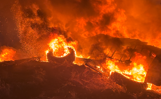 This image shows tires being burned illegally